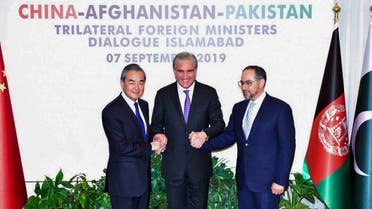 Pakistan Foreign Minister Shah Mahmood Qureshi (C) and Chinese Foreign Minister Wang Yi (L) along with Afghanistan Foreign Minister Salahuddin Rabbani (R) in Islamabad. (AFP)