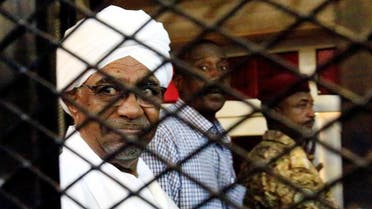 Sudan's former president Omar Hassan al-Bashir sits inside a cage at the courthouse where he is facing corruption charges, in Khartoum, Sudan August 31, 2019. REUTERS