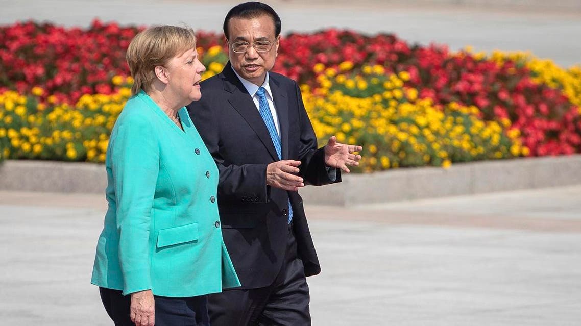 Chinese Premier Li Keqiang (right), and German Chancellor Angela Merkel attend a welcome ceremony at the Great Hall of the People in Beijing, on September 6, 2019. (AP)