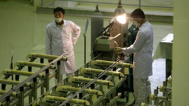In this April 9, 2009 file picture Iranian technicians work at a new facility producing uranium fuel for a planned heavy-water nuclear reactor. (File: AP) 