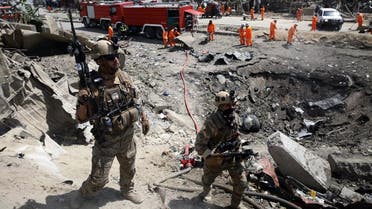 Afghan security forces walks as municipal workers gather to clean up near the crater from an attack at the Green Village in Kabul on September 3, 2019. (File photo: AFP)