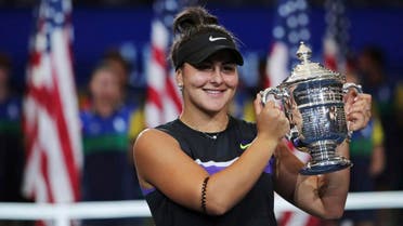 Bianca Andreescu holds up the championship trophy after defeating Serena Williams in the women’s singles final of the US Open tennis championships on September 7, 2019, in New York. (AP)