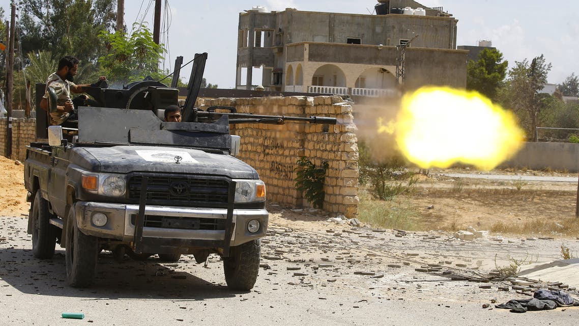 A fighter loyal to the internationally recognised Libyan Government of National Accord (GNA)fires a truck-mounted gun during clashes with forces loyal to strongman Khalifa Haftar in the capital Tripoli's suburb of Ain Zara, on September 7, 2019.