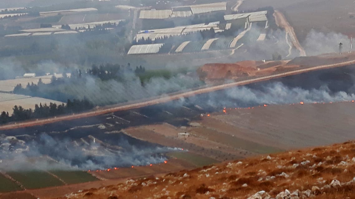This picture taken on September 1, 2019 from a location near the southern Lebanese village of Maroun al-Ras, close to the border with Israel, shows smoke rising from fires along the border with Israel on the Lebanese side following an exchange of fire. Israel and Hezbollah exchanged fire along the Lebanese border on September 1 after a week of rising tensions, but no casualties were reported following the brief flare-up and UN officials immediately urged restraint.