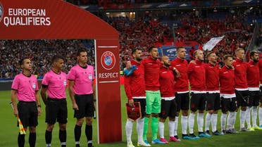 Referees and Albania's soccer team stand during Albania's national anthem, after the wrong one was playing, during of the Euro 2020 group H qualifying soccer match between France and Albania at the Stade de France in Saint Denis, north of Paris, France, Saturday, Sept. 7, 2019. (AP)