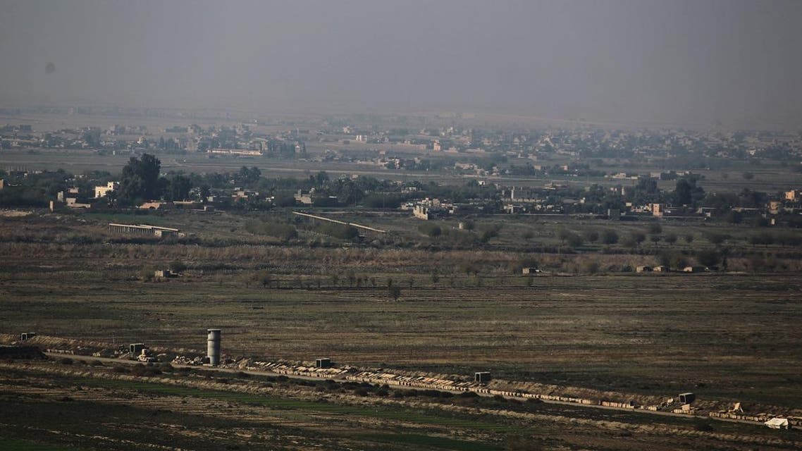 A picture taken on November 12, 2018 from al-Qaim in Iraq's border al-Anbar province shows the Syrian border city of Albu Kamal in the Deir ez-Zor region. (File photo: AFP)