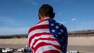Honduras migrant in US flag - AFP