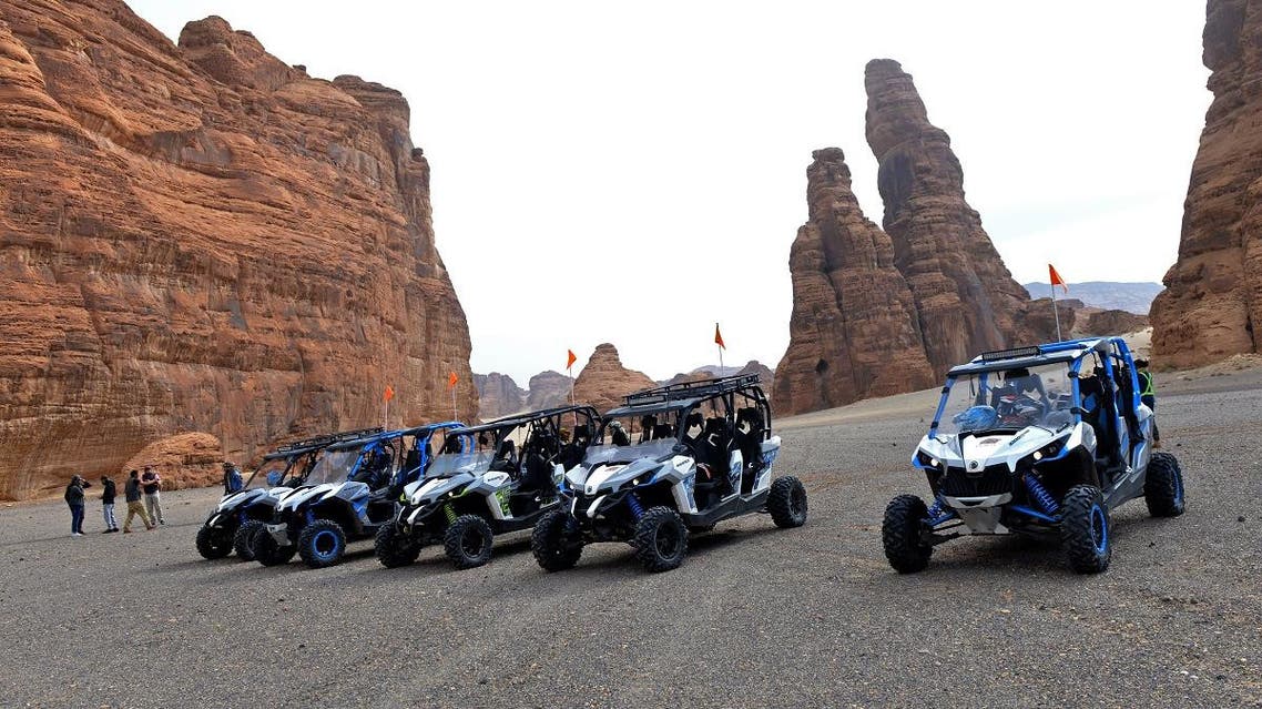 Tourists visit the Ula desert near the northwestern Saudi town of al-Ula, on January 5, 2019. (AFP)