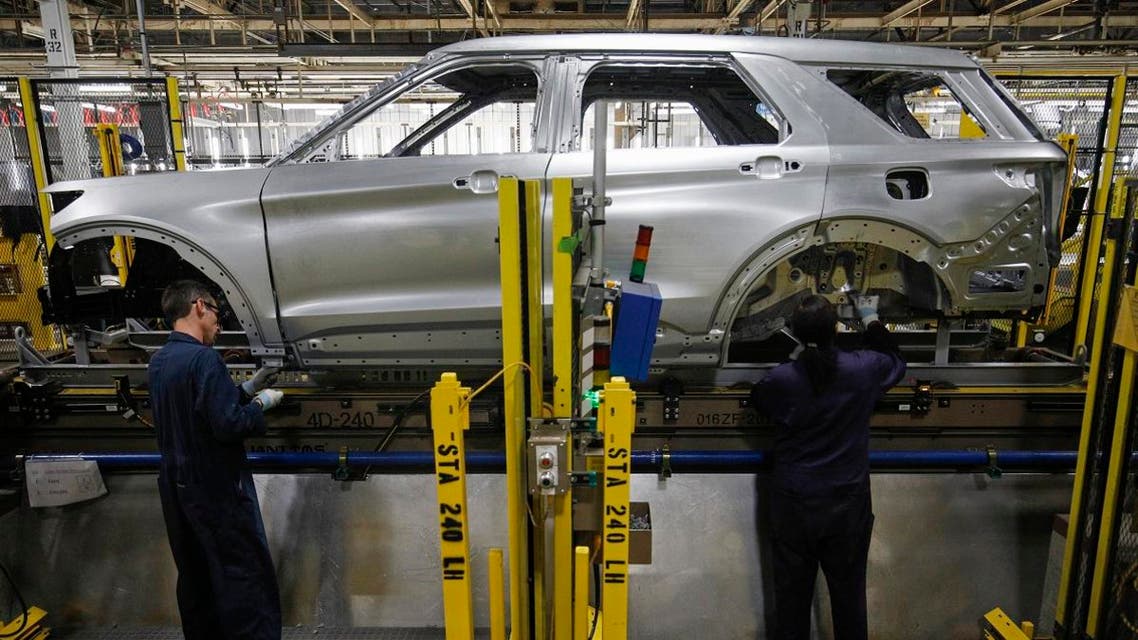 Workers assemble cars at the newly renovated Ford’s Assembly Plant in Chicago. (AFP)