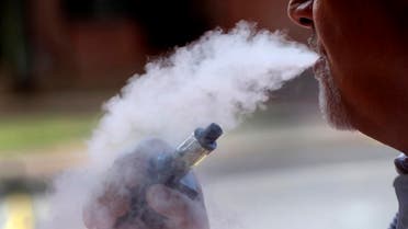A man exhales while using an e-cigarette, in Portland, Maine, in the US. (File photo: AP)