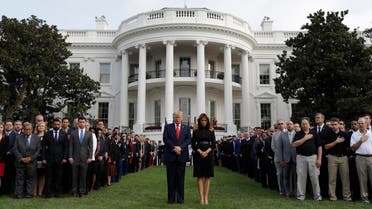 President Donald Trump and first lady Melania Trump participate in a moment of silence honoring the victims of the Sept. 11 terrorist attacks, on the South Lawn of the White House, on September 11, 2019, in Washington. (AP)