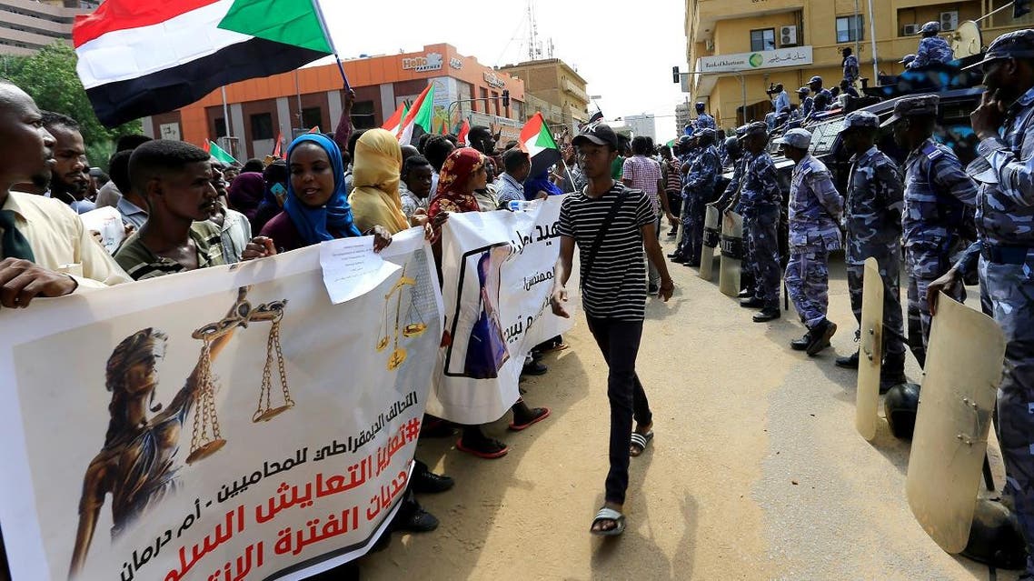 Sudanese demonstrators attend a protest calling for the appointment of top judicial officials and justice for killed demonstrators, outside the presidential palace in Khartoum. (Reuters)