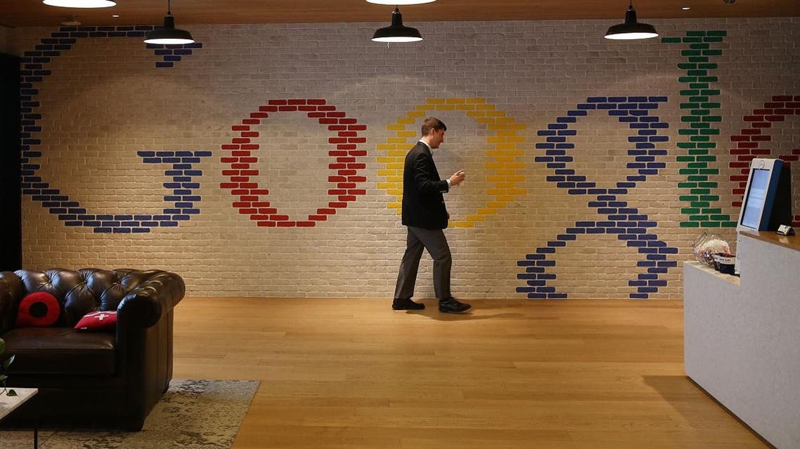 An employee walks through the lobby of Google's Washington headquarters. (File photo: AFP)