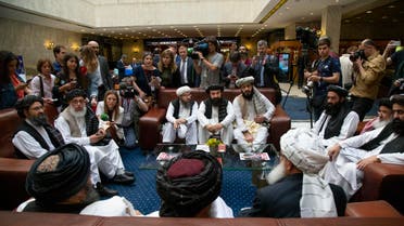 Mullah Abdul Ghani Baradar, the Taliban group's top political leader, left, Sher Mohammad Abbas Stanikzai, the Taliban's chief negotiator, second left, and other members of the Taliban delegation speak to reporters prior to their talks in Moscow, Russia. (AP)
