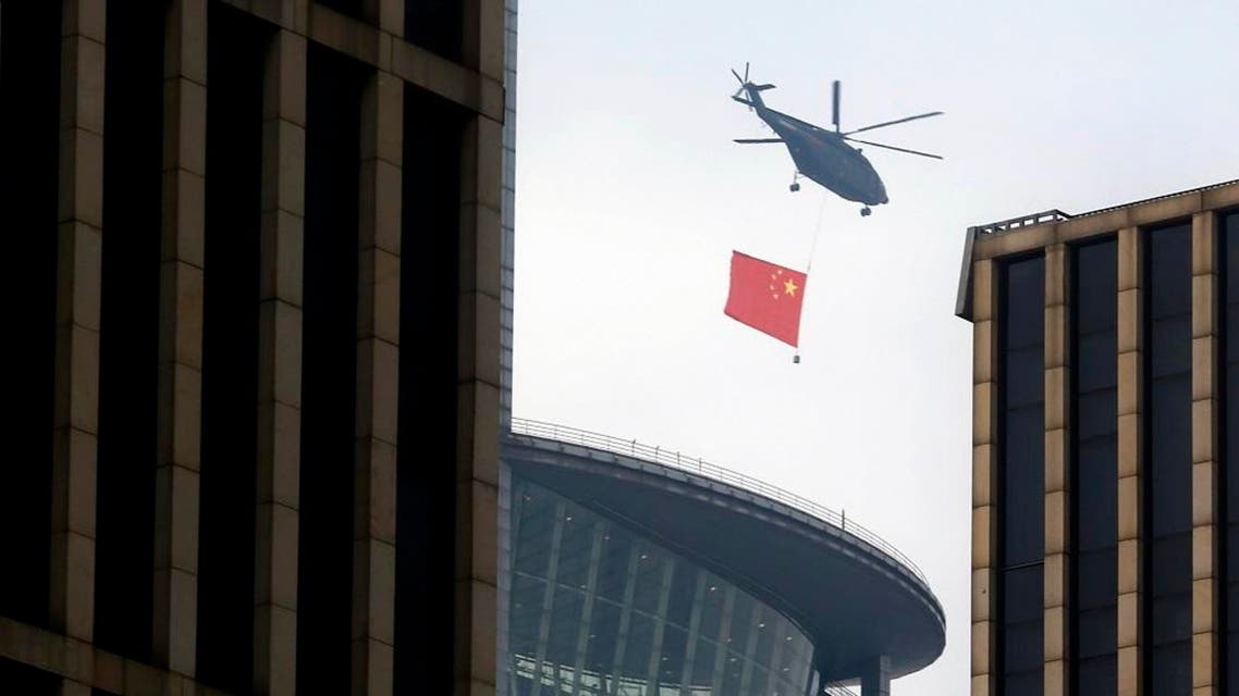 Military planes flew over the route Sunday, after tanks and other military vehicles rumbled along the same road the previous night. (AFP)
