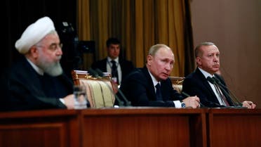 A handout picture taken and released on February 14 , 2019 by the Turkish Presidential Press service shows Iranian President Hassan Rouhani (L), Russian President Vladimir Putin (C) and Turkish President Recep Tayyip Erdogan (R) attending a press conference following a trilateral meeting on Syria in the Black Sea resort of Sochi. The leaders of Russia, Turkey and Iran met for talks on how to work more closely together in Syria as Washington prepares to withdraw its troops from the war-torn country. President Vladimir Putin hosted Turkish counterpart Recep Tayyip Erdogan and Iran's Hassan Rouhani for the talks in the southern city of Sochi.