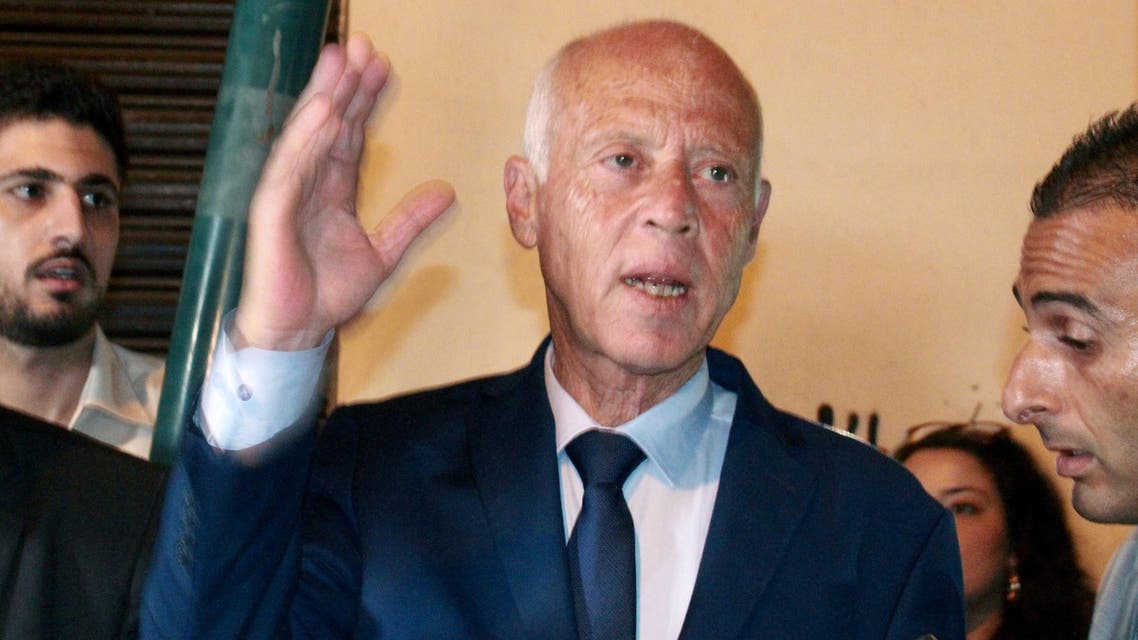 Tunisian presidential candidate Kais Saied speaks to the media at his campaign headquarters in the capital Tunis on September 15, 2019, as exit polls ahead of the preliminary results for the polls predicted him to be "first in the first round". (AFP)