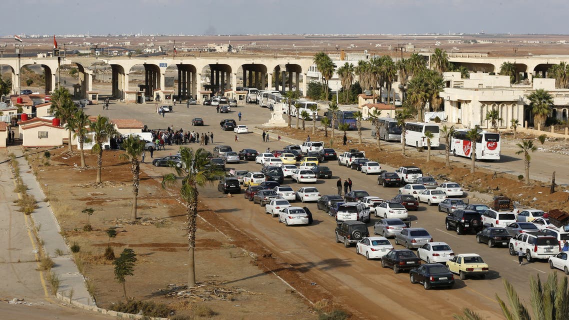 Vehicles wait to cross into Syria at the recently reopened Nassib border post in the Deraa province,at the Syrian-Jordanian border south of Damascus on November 7, 2018. Syrian regime forces retook control of the Nassib border crossing from rebels in July, and last month reopened it after a three-year closure, allowing Jordanians to dash over for cheap shopping.
