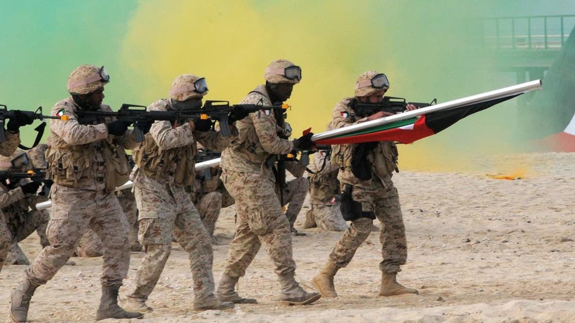 Kuwaiti marines re-enact the landing at Garouh Island, Kuwait, on Wednesday Jan. 25, 2011. (AP)