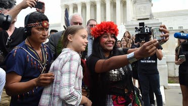 Militza Flaco (R) from the Global Alliance of Territorial Communities Guardians of the Forest takes a selfie with Swedish teen climate activist Greta Thunberg in front of the Supreme Court to support the children’s climate lawsuit against the US on September 18, 2019 in Washington, DC. (AFP)