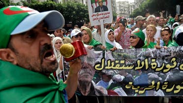 Algerian protesters take part in a demonstration against the country’s army chief in Algeria’s capital Algiers on September 20, 2019, as the police toughens its line ahead of December elections. (AFP)