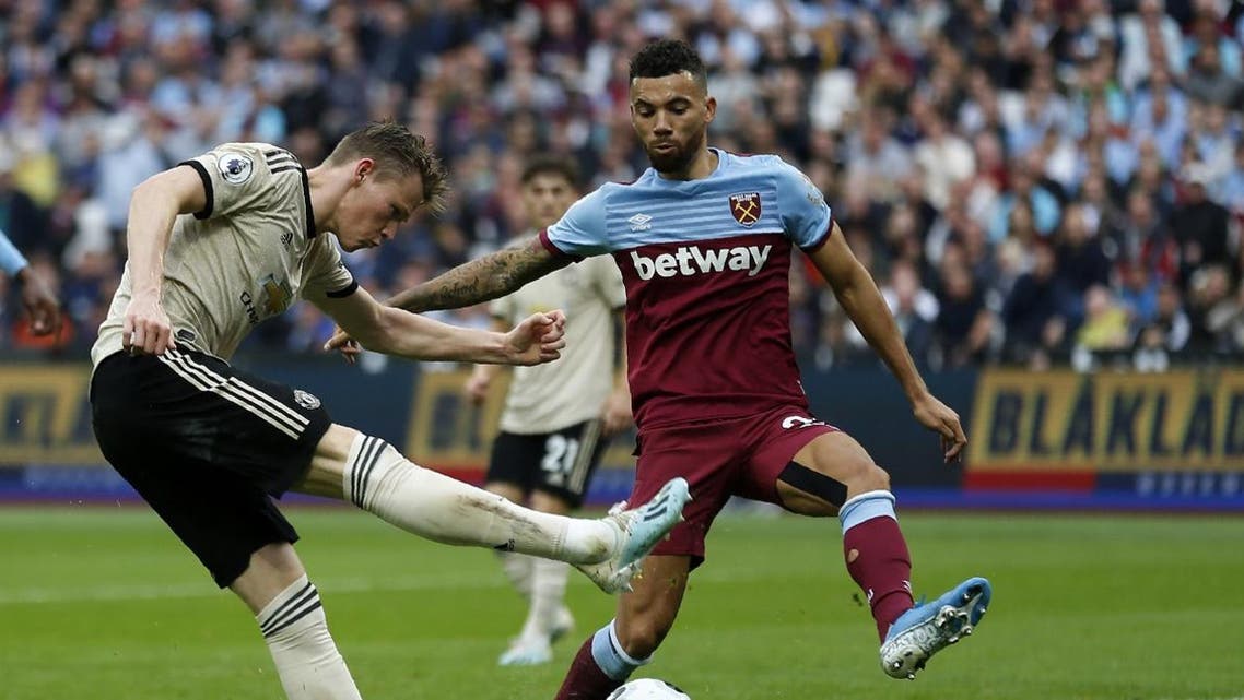 Manchester United's English midfielder Scott McTominay (L) vies with West Ham United's English defender Ryan Fredericks during the English Premier League football match between West Ham United and Manchester United at The London Stadium, in east London on September 22, 2019. (AFP)