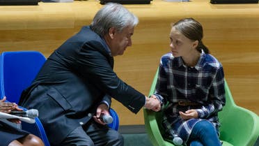 Swedish environmental activist Greta Thunberg (right), shakes hands with UN Secretary-General Antonio Guterres, during the Youth Climate Summit at United Nations headquarters, on September 21, 2019. (AP)