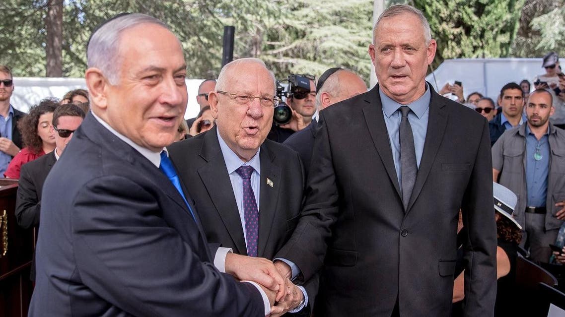 Israeli Prime Minister Benjamin Netanyahu (L), President Reuven Rivlin (C) and Benny Gantz, leader of Blue and White party, attend a memorial ceremony for late Israeli president Shimon Peres, at Mount Herzl in Jerusalem on September 19, 2019. (AFP)