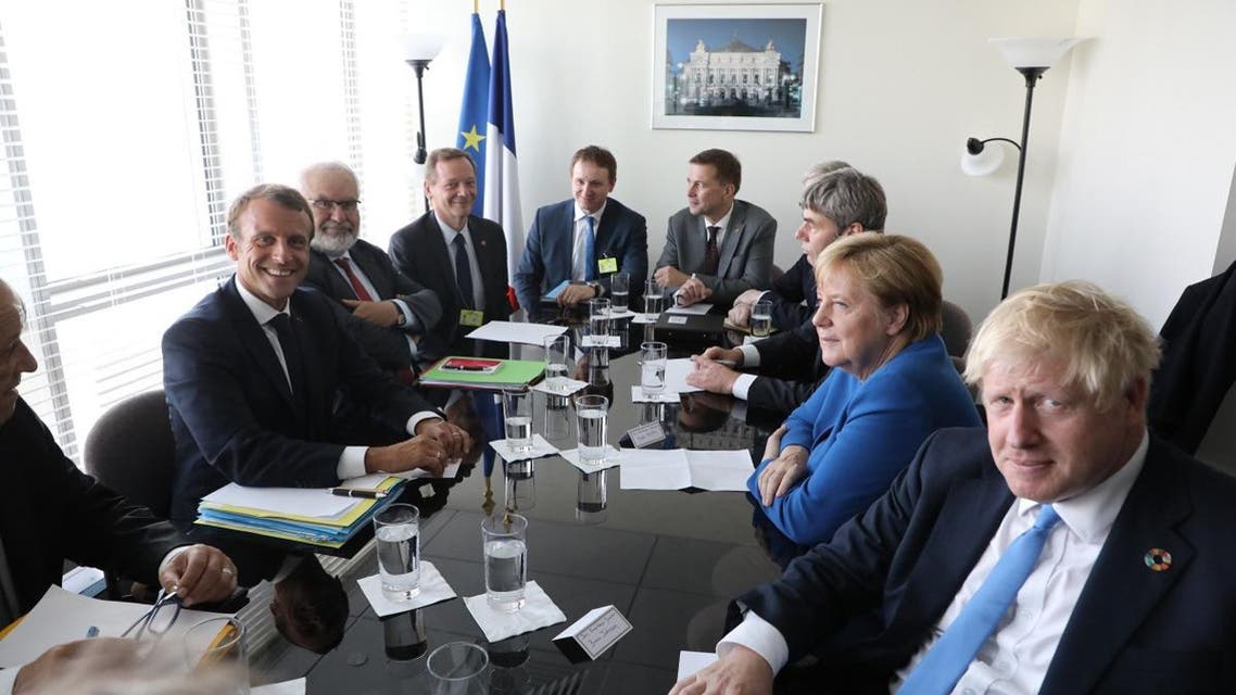 French President Emmanuel Macron (L) meets with German chancelor Angela Merkel (2-R) and British prime minister Boris Johnson (R) at the United Nations headquarter on september 23, 2019, in New York. (AFP)