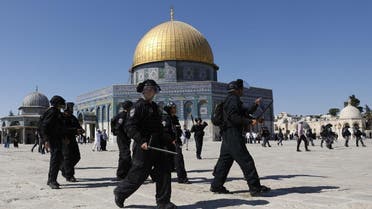 Israeli security forces walk past the Dome of the Rock mosque as they arrive at the Al-Aqsa mosques compound in the Old City of Jerusalem on August 11, 2019. (AFP)