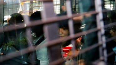 Agnes Chow, a member of the Demosisto, a pro democracy party in Hong Kong, is seen in a police van as she is brought to the Eastern Court after her arrest, in Hong Kong. (Reuters)