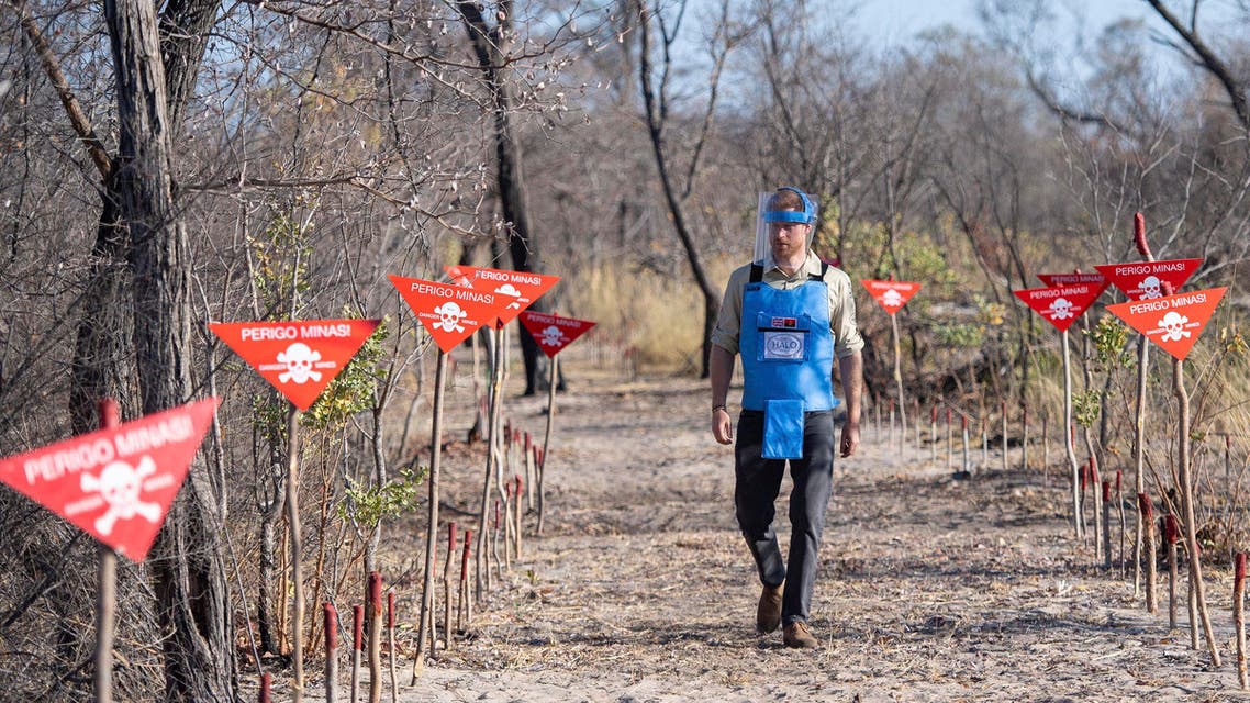 Britain's Prince Harry walks through a minefield in Dirico, Angola, Friday Sept. 27, 2019, during a visit to see the work of landmine clearance charity the Halo Trust, on day five of the royal tour of Africa. (AP)
