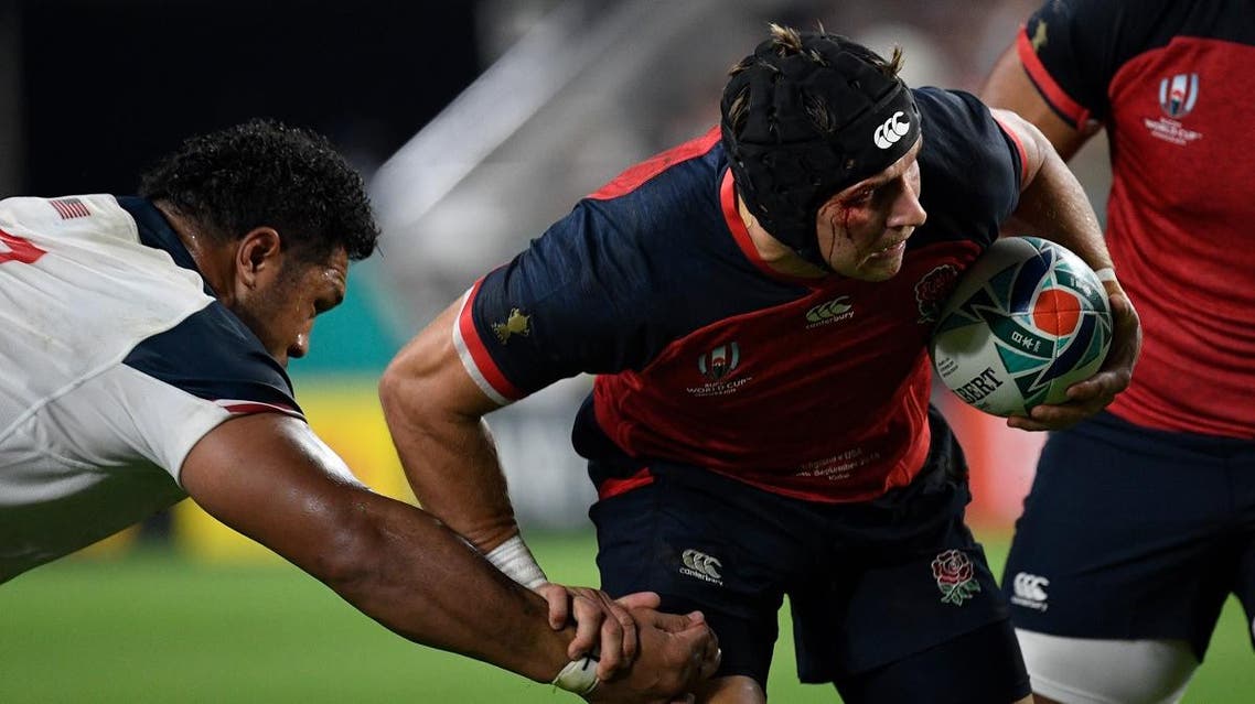 Piers Francis (R) runs with the ball during the Japan 2019 Rugby World Cup Pool C match between England and the United States. (AFP)