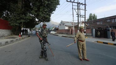 Policemen stand guard outside the residence of former chief minister of the Jammu and Kashmir state Farooq Abdullah in Srinagar. (Reuters)