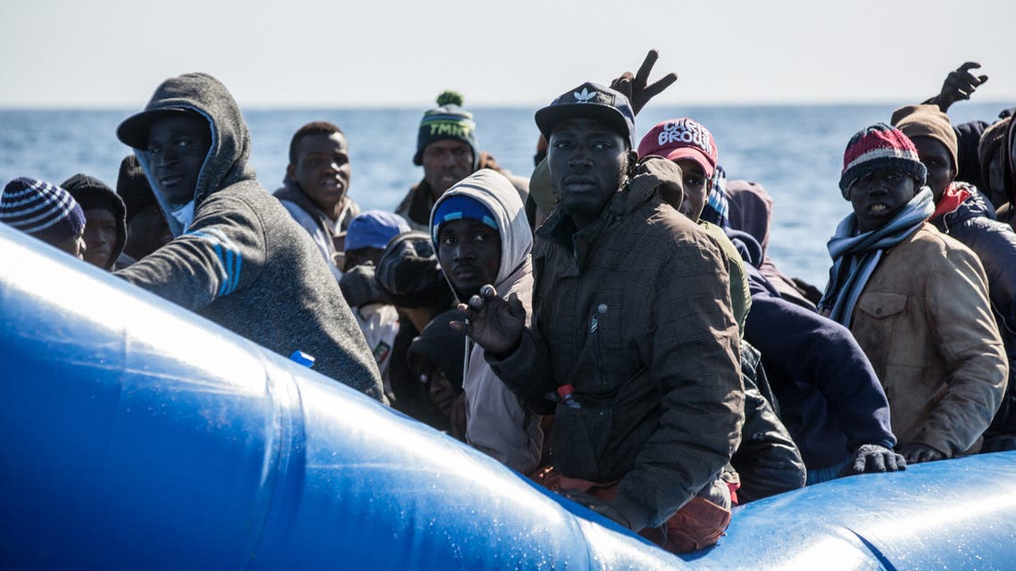 An unflatable boat with 47 migrants on board is pictured while being rescued by the Dutch-flagged Sea Watch 3 off Libya's coasts on January 19, 2019. The German charity group Sea Watch said on January 19 that it had rescued 47 migrants from an inflatable boat, but it was not known if they belonged to the same group that was feared missing off the Libyan coast, the International Organization for Migration said on January 19 after the Italian navy flew three survivors to the Mediterranean island of Lampedusa.