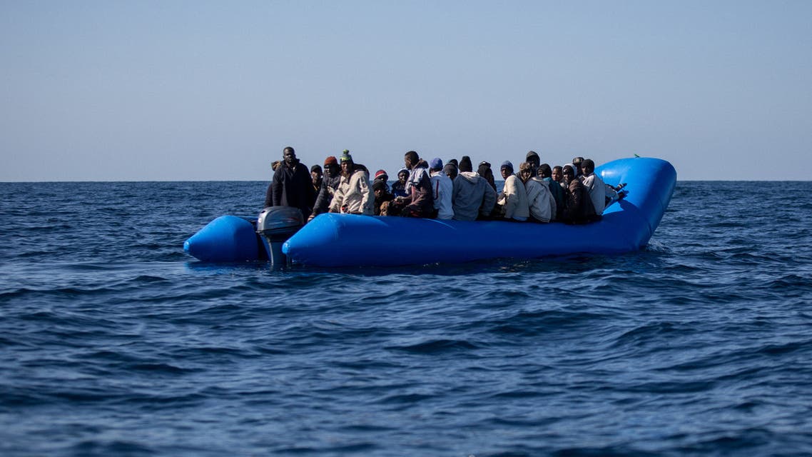 An unflatable boat with 47 migrants on board is pictured while being rescued by the Dutch-flagged Sea Watch 3 off Libya's coasts on January 19, 2019. The German charity group Sea Watch said on January 19 that it had rescued 47 migrants from an inflatable boat, but it was not known if they belonged to the same group that was feared missing off the Libyan coast, the International Organization for Migration said on January 19 after the Italian navy flew three survivors to the Mediterranean island of Lampedusa.