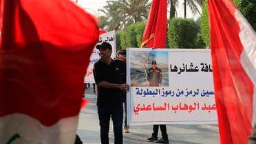 In this Saturday, Sept. 28, 2019, photo, protesters gather during a demonstration to support Lt. Gen. Abdul-Wahab al-Saadi, in the poster, in Baghdad, Iraq.  (AP)
