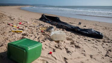 Rests of an inflatable boat used by migrants lies on the Hierbabuena beach in Barbate on November 26, 2018. (AFP)