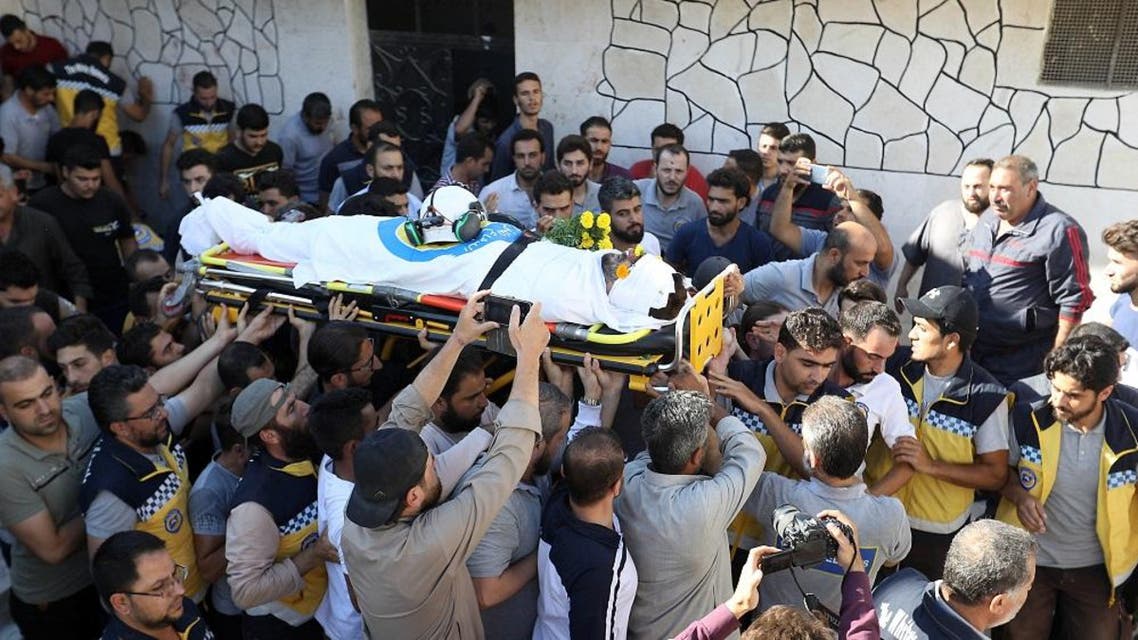 Members of the Syrian Civil Defence known as "White Helmets" and friends carry the body of citizen journalist Anas al-Dyab during his funeral in Idlib on July 21, 2019. (AFP)