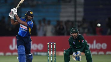 Sri Lanka’s batsman Shehan Jayasuriya (L) plays a shot as Pakistan's captain and wicketkeeper Sarfraz Ahmed looks on during the second one day international (ODI) cricket match between Pakistan and Sri Lanka at the National Cricket Stadium in Karachi on September 30, 2019. (AFP)