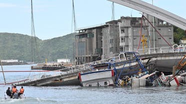 A fishing boat is pictured after it was crushed when a bridge collapsed in Nanfangao harbour in Suao township on October 1, 2019. (AFP)