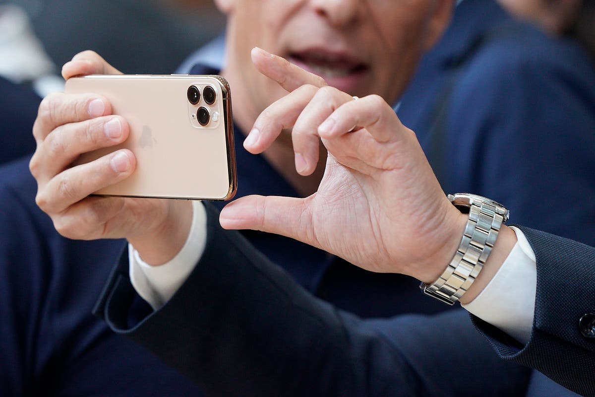 Apple team members demo the new cameras on iPhone 11 Pro for guests during an event to announce new products on Sept. 10, 2019, in Cupertino, California. (AP)