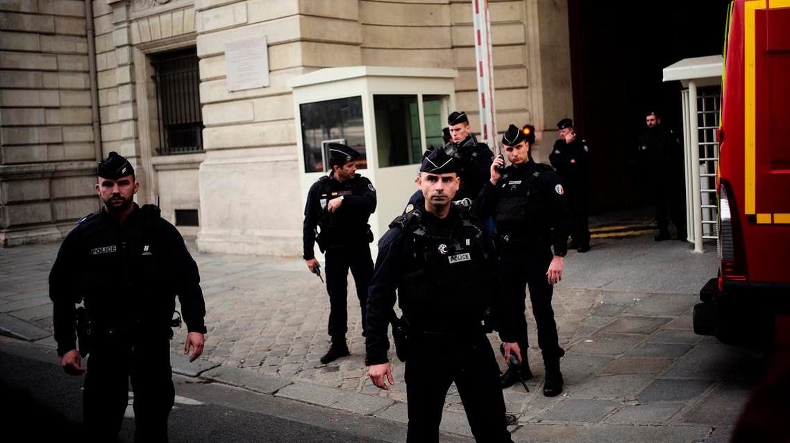 Police officers stand outside the Paris police headquarters, Thursday, Oct.3, 2019 in Paris. (AP)