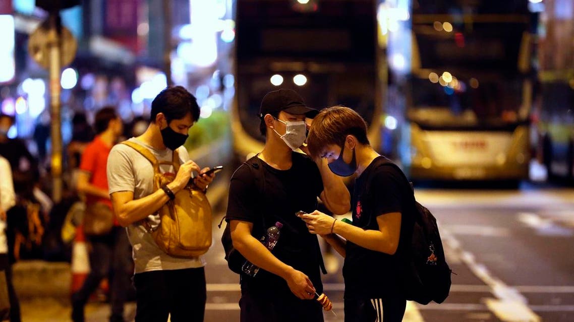 Protesters wear masks on the streets of Hong Kong on Friday, Oct. 4, 2019.  (AP)