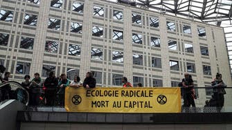 Climate activists block a Paris mall in call for action