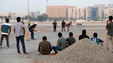 People play cricket on a patch of wasteland in Doha, Qatar, Friday, Oct. 4, 2019. AP
