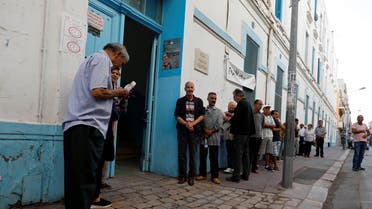 People wait to cast their votes outside a polling station during parliamentary elections, in Tunis, Tunisia October 6, 2019. REUTERS