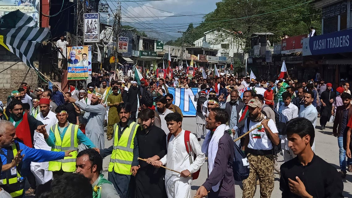 Supporters of Jammu Kashmir Liberation Front start marching toward the Line of Control, in Muzaffarabad, the capital of Pakistani Kashmir, Saturday, Oct. 5, 2019.