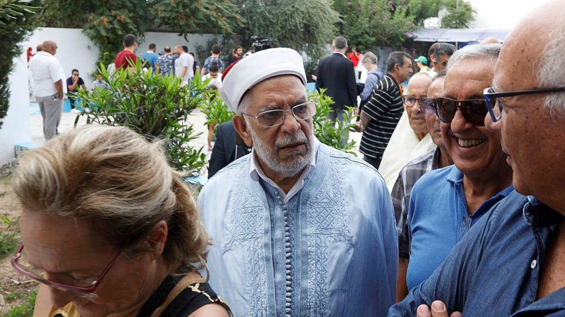Abdelfattah Mourou, vice president of the moderate Islamist Ennahda party and presidential candidate, stands outside a polling station during presidential election in Tunis. (Reuters)