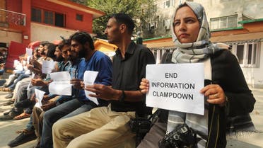 Kashmiri journalists display placards during a protest against the communication blackout in Srinagar, Indian controlled Kashmir, on Oct. 3, 2019. (AP)